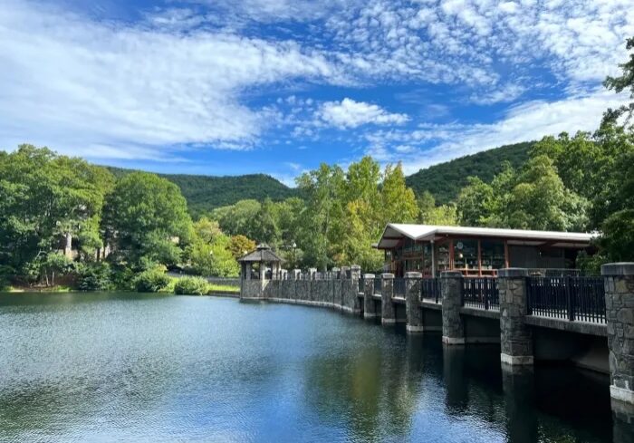 Stone pier and pavilion beside mountain lake Stone pier and pavilion beside mountain lake
