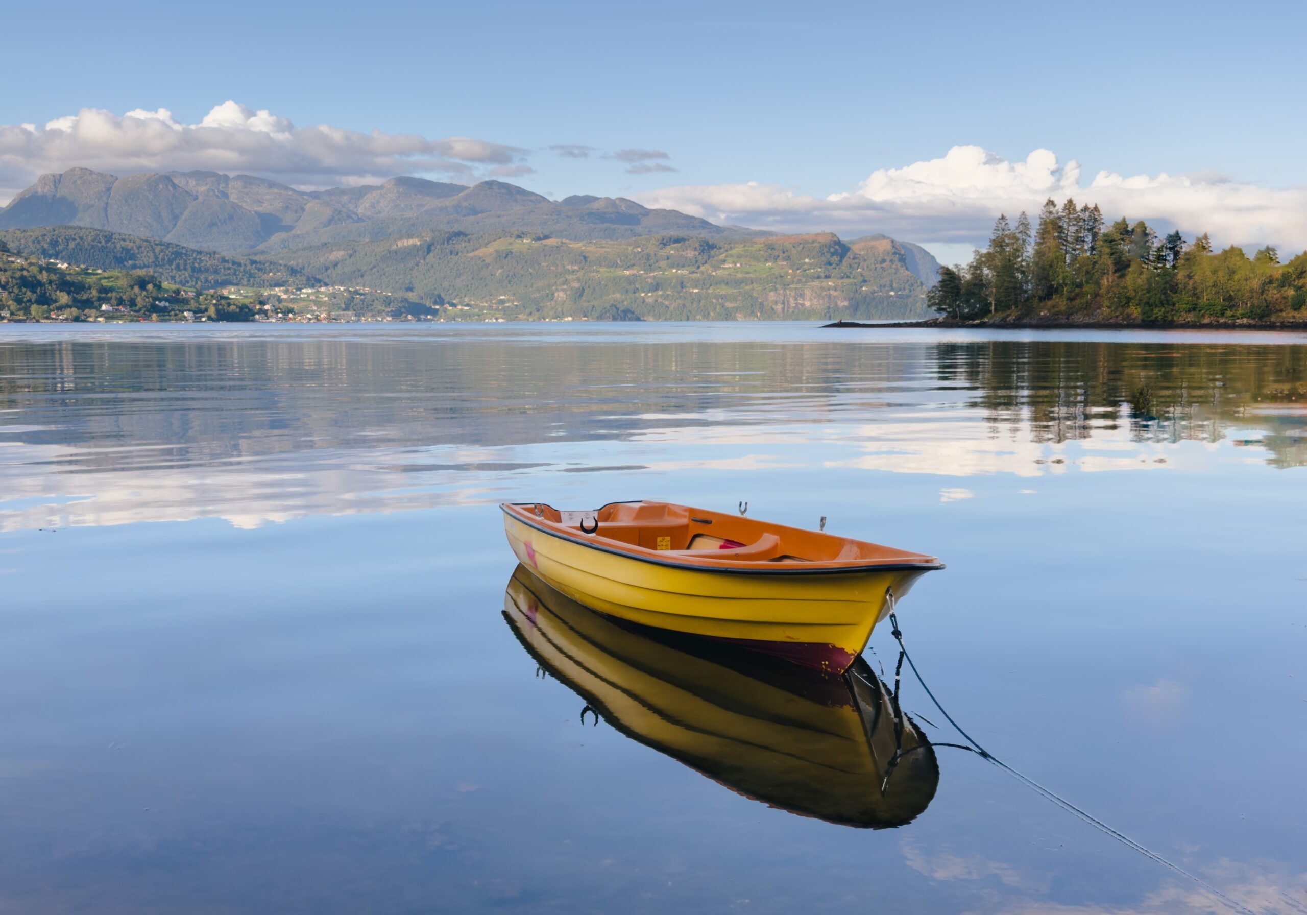 A,Yellow,Boat,On,The,Sea,With,A,Beautiful,Calming